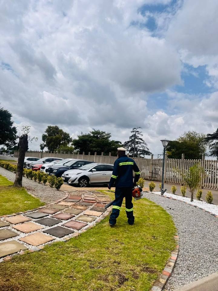 Fresh Lavation team maintaining paving and borders